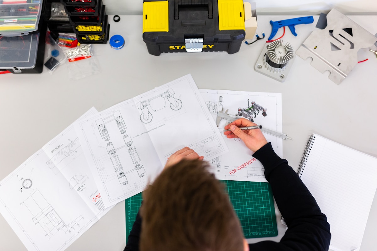 Engineering compass and drafting tools representing geometric construction and precision